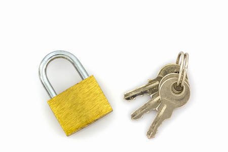 Close up key and lock on white background.の写真素材