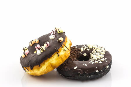 Chocolate donut with Sprinkles on white background.の写真素材