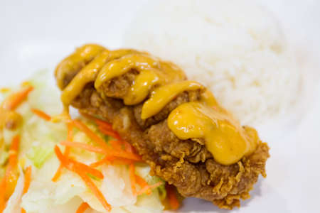 Organic Crispy Chicken Strips with sauce on platesの写真素材