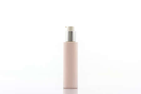 Pink cosmetics bottle, packaging on white background.の写真素材