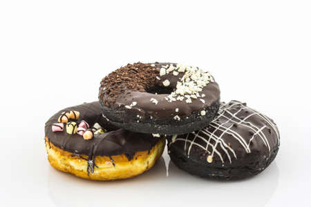 Chocolate donut with Sprinkles on white background.の写真素材