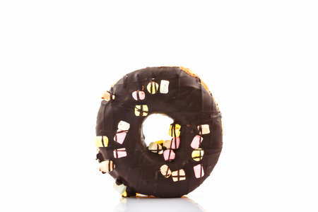 Chocolate donut with Sprinkles on white background.の写真素材