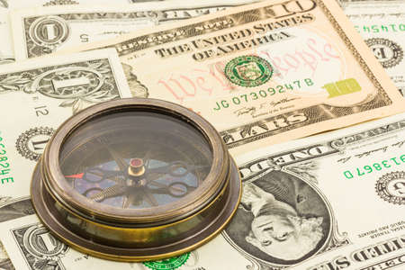 Compass on dollar banknote  background.の写真素材