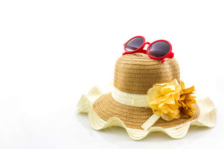 Woven hat, with red sunglasses on white background.