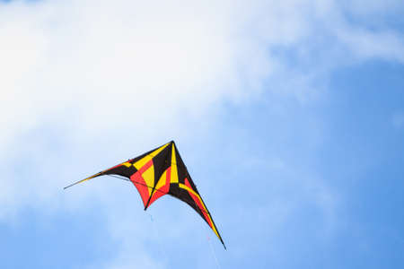Colorful of kite flying in the wind on blue sky background..