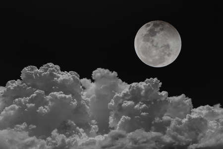 Backgrounds night sky of the full moon with clouds.