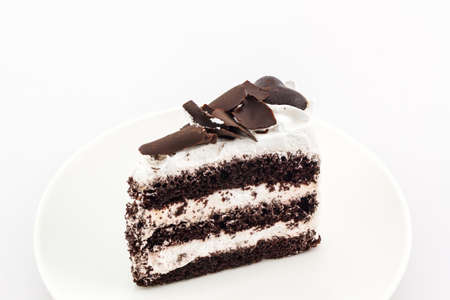 Chocolate cake slice on white background.