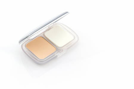 Makeup powder in white case on white background.の写真素材