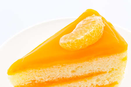 Oranges cake slice,fruit cake on white background.の写真素材