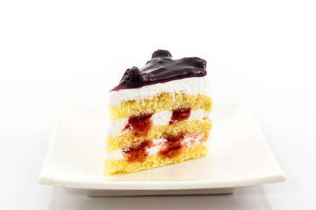 Blueberry Cake slice on white background.の写真素材