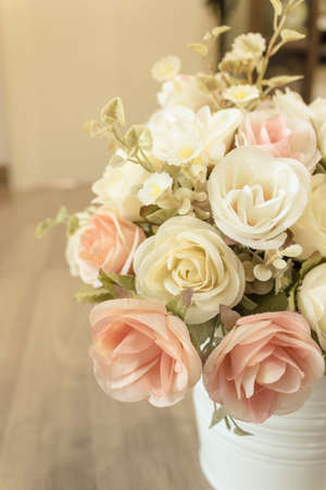 Decorative sweet flower in vase on the table at Cafe.の写真素材
