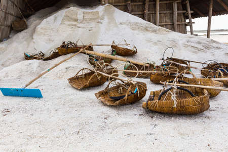 Tools of the salt farmers on salt pans, ready for harvest, south of Thailand.の写真素材