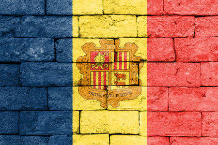 Flag of Andorra painted over on old brick wall.の写真素材