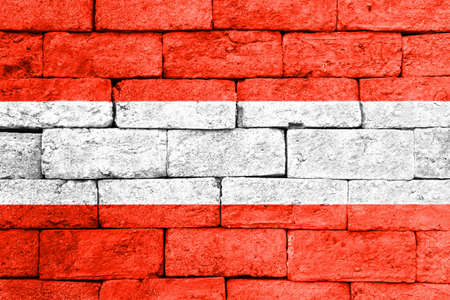 Flag of Austria painted over on old brick wall.の写真素材