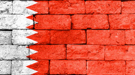 Flag of Bahrain painted over on old brick wall.の写真素材