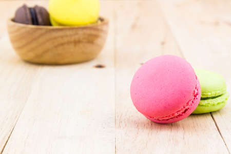 Sweet and colourful french macaron on wood background, Dessert.の写真素材