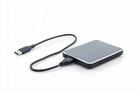 External hard drive for backup on white background.の写真素材