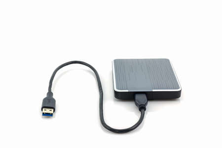 External hard drive for backup on white background.の写真素材