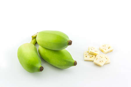 Bunch of raw green bananas and Banana slices on white background.の写真素材