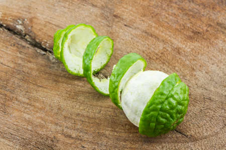 Kaffir Lime (Bergamot) on wood background.の写真素材