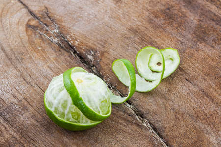 Fresh limes on wood background.の写真素材
