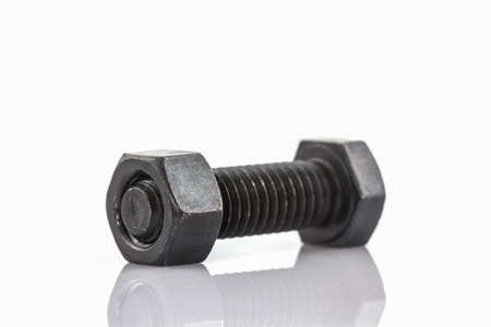 Closeup metal screw, bolt and nuts on white background.の写真素材