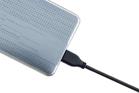 External hard drive for backup on white background.の写真素材