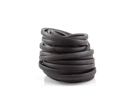 Black engine belt accessories used on automobiles to turn all the accessories on the engine on white background.の写真素材