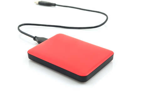 External hard drive for backup on white background.の写真素材