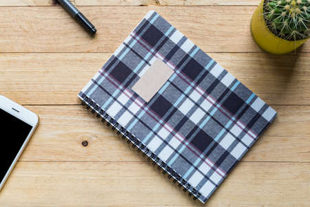 Spiral notebook or ring binder book on wooden table.の写真素材