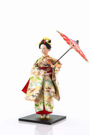 Japanese geisha dolls on white background.の写真素材