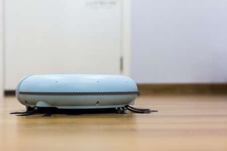Robotic vacuum cleaner on the floor.の写真素材