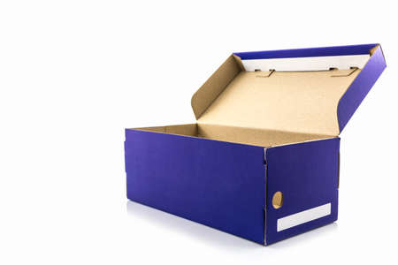Blue shoe box with clipping path on white background. Paper box for shoes, electronic device and other products.の写真素材