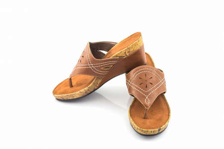 Brown womans shoes on white background.の写真素材