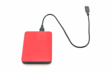 External hard drive for backup on white background.の写真素材