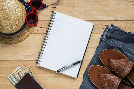 Flat lay travel accessories costumes notebook and copy space. Passports,The cost , jean ,sunglasses, hat. Top view.の写真素材