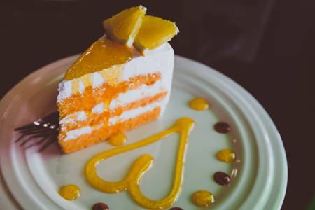 Oranges cake slice, Fruit cake. Vintage color tone.の写真素材