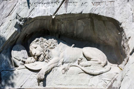 Dying Lion monument (Lowendenkmal) on the stone in Luzern, Switzerland. carved in the rock to honor Swiss Guards who were massacred during the French Revolution when revolutionaries stormed the Tuileries Palace.のeditorial素材
