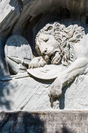Luzern, Switzerland - May 27, 2017: Dying Lion monument (Lowendenkmal) on the stone in Luzern (Lucerne). Carved in the rock to honor Swiss Guards who were massacred during the French Revolution when revolutionaries stormed the Tuileries Palace.のeditorial素材