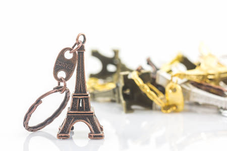 Souvenir key chain of mini eiffel tower (Tour Eiffel) white background.
