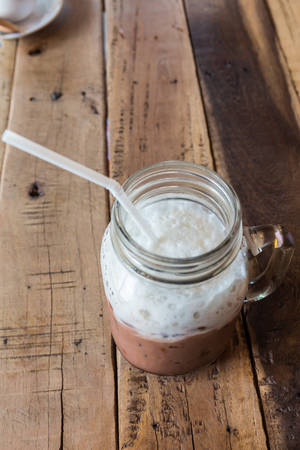 Iced Chocolate drink on a wooden table.の写真素材