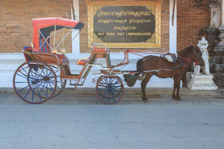 Horse Carriage at Wat Phra That Lampang Luang, Lanna-style Buddhist temple in Lampang. Thailand.の写真素材