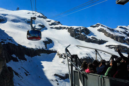 Mt. Titlis, Switzerland - May 28, 2017: a gondola of the Rotair cable car, view from the station on the top of the mountain. Rotair gondolas make a 360 degrees turn during.のeditorial素材
