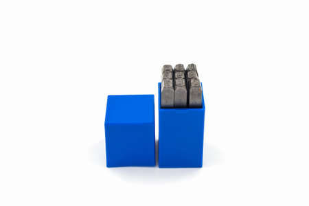 The metal lettering stamps punch set in a plastic box on the white background.
