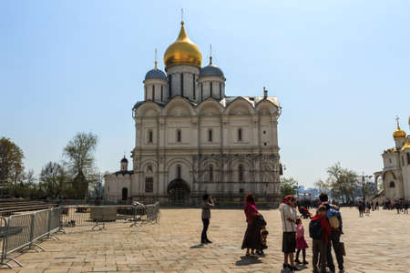 Tourists visit The Cathedral of the Archangel is the largest church in the Moscow Kremlin, Russia