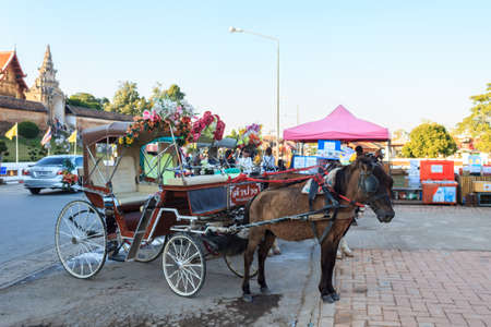 Lampang, Thailand - December 23, 2017: Horse Carriage at Wat Phra That Lampang Luang, Lanna-style Buddhist temple in Lampang. Thailand.のeditorial素材