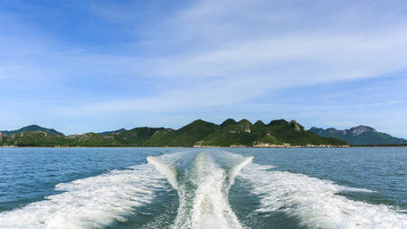 Wave of trace tail of speed boat on water surface in the sea.の写真素材