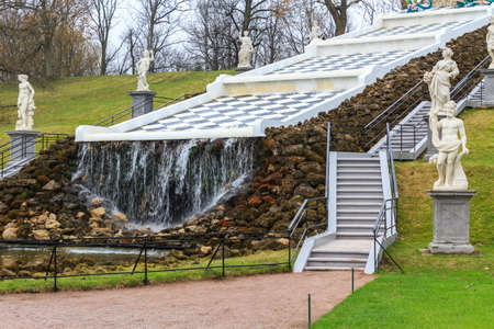 Saint Petersburg, Russia - May 2, 2018: Artificial waterfall in The Peterhof Palace garden. St. Petersburg, Russia.のeditorial素材