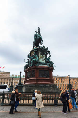 Saint Petersburg, Russia - May 3, 2018: Tourists visit The Monument to Nicholas I on St. Isaac's Square at St.Petersburg, Russia.のeditorial素材