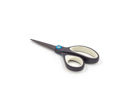 Single black steel scissors isolated on white background.の写真素材